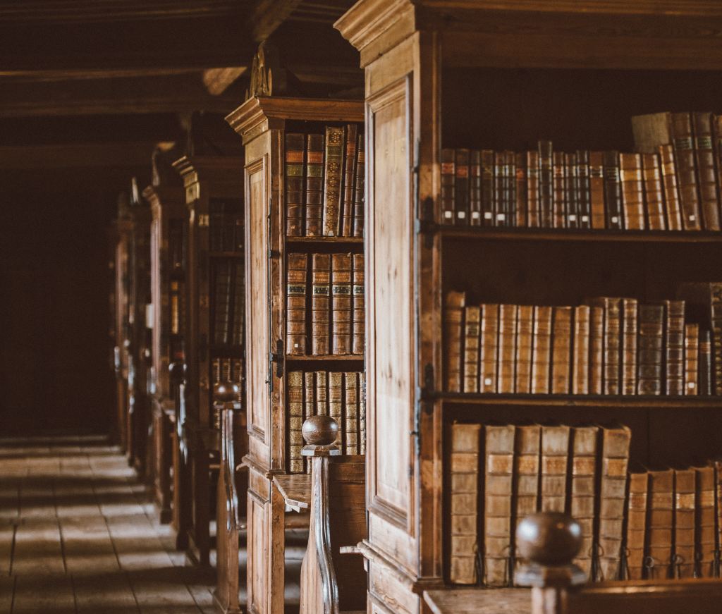 wooden shelves of books in an old library